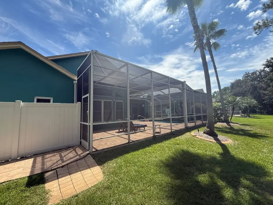 Completed aluminum pool cage enclosure at a Hudson, Florida home