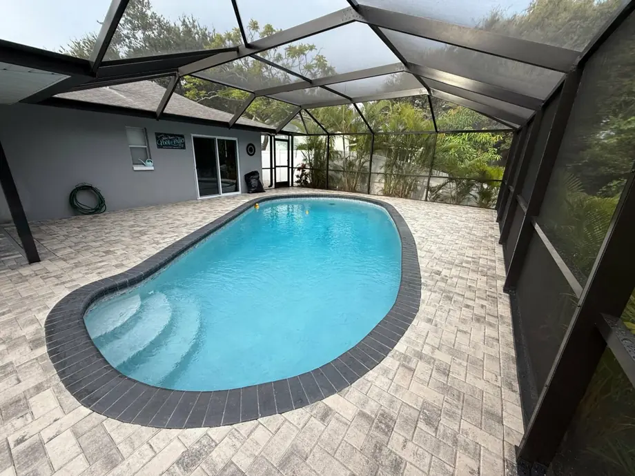Completed 7-inch super gutter and fascia replacement on a pool enclosure in New Port Richey, Florida