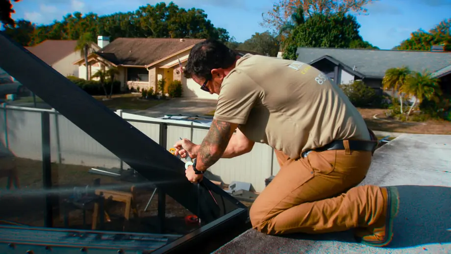 Fitting the roof screen panels on a new pool cage